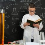 periodic table and a highlighted textbook open beside them